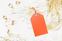 Orange tag with bauble and party streamer mockup