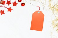 Festive orange tag on white marble background