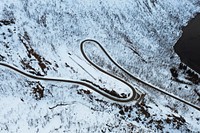 Drone shot of a snowy winding road in Norway 
