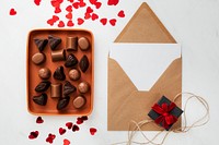 Valentines day card by a tray of chocolates