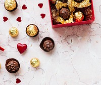 Chocolates in a box on a marble texture background
