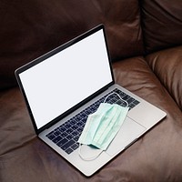 Medical mask on a laptop 