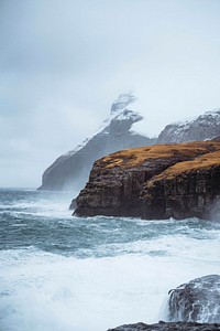Stormy waves hitting the cliffs at Molin beach in Streymoy island, Faroe Islands