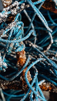 Blue ropes and rusty fishing equipment textured mobile wallpaper