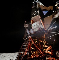 Astronaut Edwin E. Aldrin Jr., lunar module pilot, is photographed egressing the Lunar Module (LM) during the Apollo 11 extravehicular activity (EVA) on the moon. Original from NASA. Digitally enhanced by rawpixel.