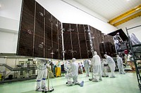 Technicians stow for launch solar array #2 for NASA Juno spacecraft. Original from NASA. Digitally enhanced by rawpixel.