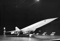 Fixed Wing Supersonic Transport in Ames 40x80 Foot Wind Tunnel. 3/4 front view of Fixed Wing SST - Lockheed SST on Ground Plane with leading edge flaps deflected in Ames 40x80 foot Wind Tunnel, May 13th,1965. Original from NASA. Digitally enhanced by rawpixel.