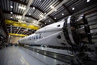 CRS–6 (2015). Falcon 9 and Dragon undergoing prep in Florida in advance of 4/13 launch to the International Space Station. Original from Official SpaceX Photos. Digitally enhanced by rawpixel.