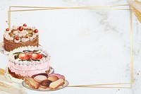 Gold frame with cakes on marble texture background