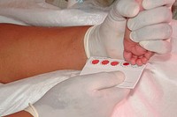 A healthcare worker extracting a blood sample from the right big toe of an infant. Original image sourced from US Government department: Public Health Image Library, <a href="https://www.rawpixel.com/search/cdc?sort=curated&amp;page=1">Centers for Disease Control and Prevention</a>. Under US law this image is copyright free, please credit the government department whenever you can&rdquo;.
