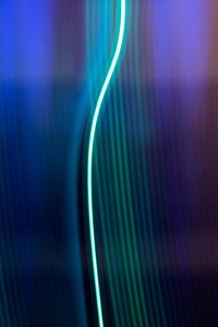 Neon light trail on metallic background