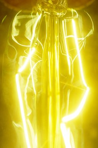 Close up of a retro yellow light bulb background