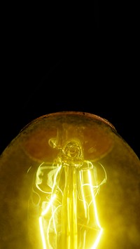 Close up of a retro yellow light bulb mobile wallpaper