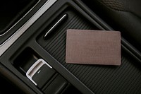 Blank brown business card on a center of car console space