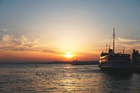 Sunset and a ship anchored in the port