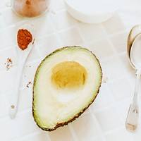 Sliced organic avocado on the kitchen table