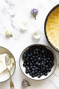 Preparation of blueberry cheesecake aerial view