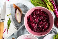 Freshly diced beetroot in a cup food photography aerial view