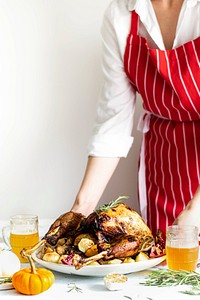 Woman preparing for roasted turkey for thanksgiving