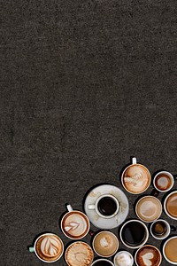 Various coffee mugs on a black grunge textured background