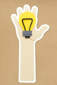 Hand holding a light bulb paper craft sticker