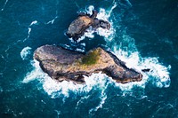 Rocky island among a deep blue ocean