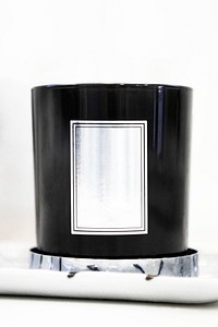 Close up of black candle on white background