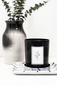 Black candle by a vase