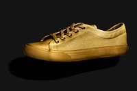 Unisex golden sneakers on a black background 