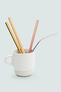 Set of reusable straws in a white cup