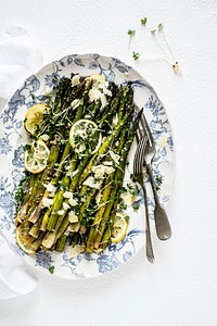 Baked asparagus with lemon in a plate 