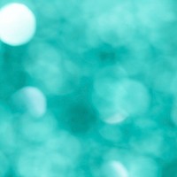 Shiny blurry turquoise glitter textured background