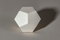 3D silver pentagon shaped paper craft on a gray background