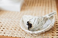 Burning sage smudge to cleanse the house