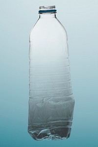 Crumpled plastic bottle mockup polluting the environment