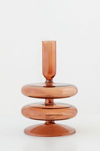 Modern shiny brown candle holder on off white background