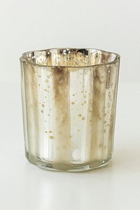 Glass candle holder on off white background