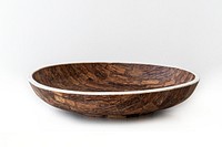 Rustic decorative wooden bowl on off white background