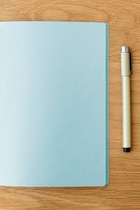 Blank plain blue notebook page with a pen mockup