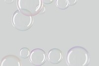 Transparent soap bubble frame design element on a gray background