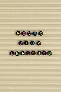 Never stop learning alphabet beads word typography