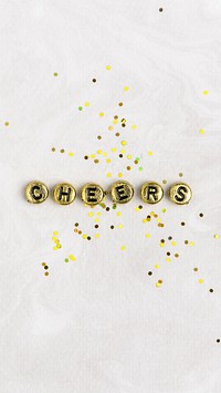 Gold CHEERS beads message typography on white
