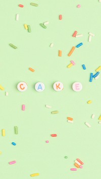 CAKE word beads lettering on green