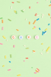 CAKE beads word lettering on green