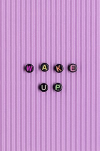 WAKE UP beads word typography on purple