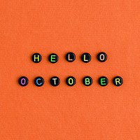 HELLO OCTOBER beads text typography on orange