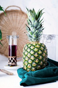Fresh pineapple on white table 