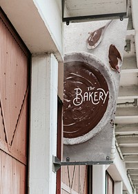 Bakery shop signage with melted chocolate background