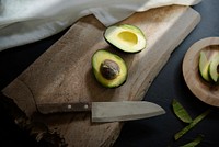 Fresh cut avocado on a wooden cutting board