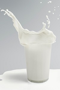 Fresh milk splashing from a glass